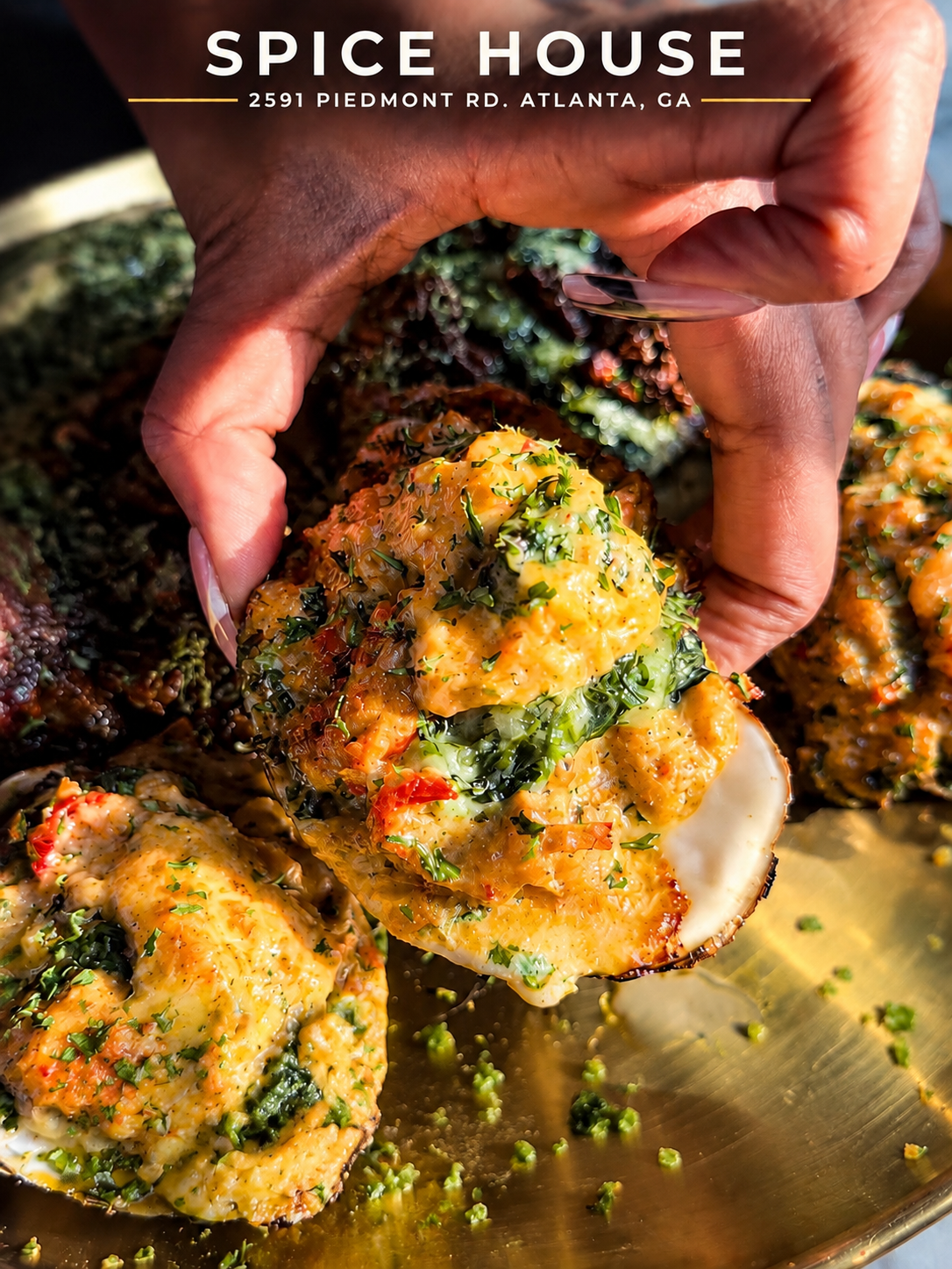 Loaded Seafood char-grilled oyster piled with crabmeat, lobster, shrimp and Parmesan at Spice House Buckhead